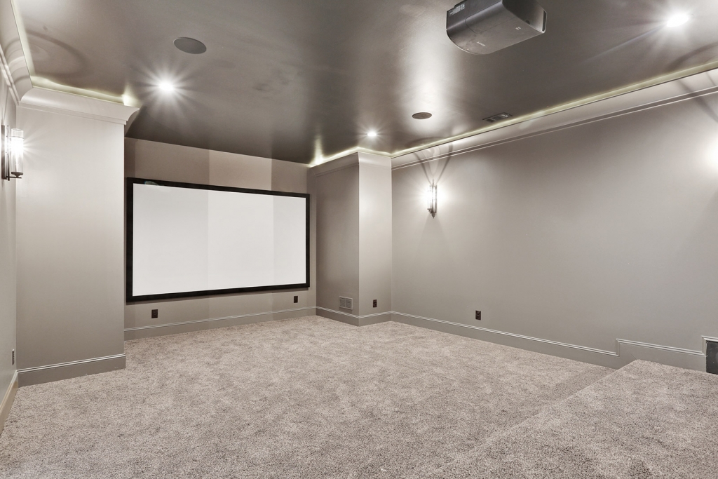 Empty small theater with gray floors and walls